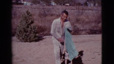 1968: the dog playing crazy when see the towel COTTONWOOD, ARIZONA