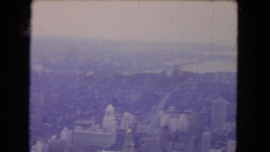 1964: Picturesque View of a Dense City Skyline with Water in the Background