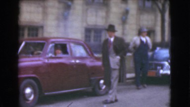 1939: Men Wearing Overcoats, Three-Piece Suits and Hats in a Downtown Business