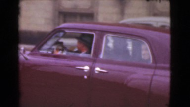 1939: Woman Crossing Road with Cars in Los Angeles, California