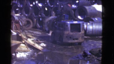 1939: factory forklift driver showing off reversing skills LOS ANGELES