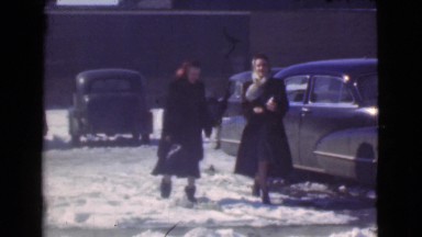 1939: women walking past cars LOS ANGELES, CALIFORNIA