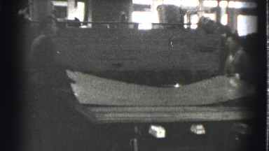 1939: Two Hard-Working Men Operate Heavy Machinery Transforming Large Metal Sheets