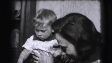 1942: A Baby Boy Plays Inside With a Woman and Pulls Her Hair Very Hard