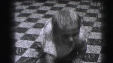 1942: Cute Baby in Kitchen Learning to Crawl Forwards and Backwards.