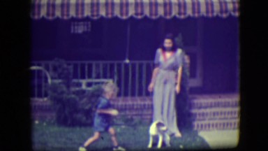 1946: mom and son playing with dog LAS VEGAS, NEVADA