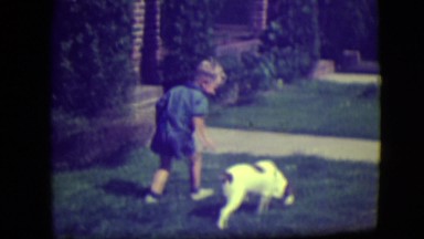 1946: oh, chores! learning to walk the boy! father sends young son out to walk