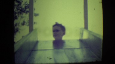 1946: Little Boy Sliding Down Metal Slide in Las Vegas Park