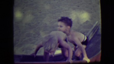 1946: children at a playground climbing up a slide. LAS VEGAS, NEVADA