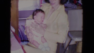 1961: baby along with mummy SALTON SEA, CALIFORNIA