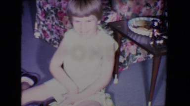 1961: two kids are playing with toy cars. they are brothers and they are happy
