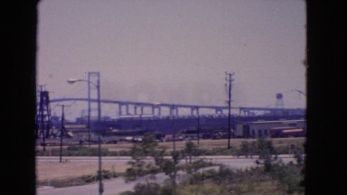1966: video of a bridge on the other side and in the distance from an industrial