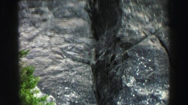 1969: huge rock up in the sky illuminated golden by the sunlight YOSEMITE,