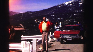 1969: a group of people observe a lake and its surroundings from a lookout