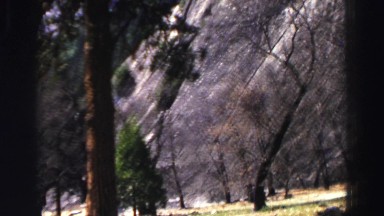 1969: a small but very steep rocky mountain rises with very little vegetation
