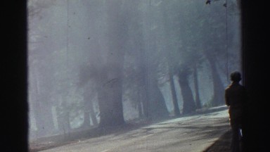 1969: one person showing in alone on road to watch outside YOSEMITE, CALIFORNIA