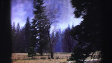 1969: a cloudy blue sky over a beautiful, rugged, smoky mountain