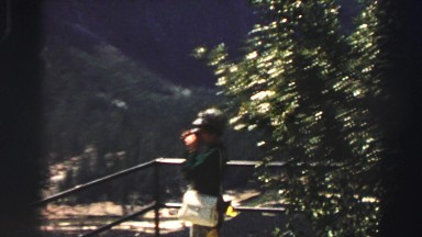 1969: the woman watching something beside the big mountain YOSEMITE, CALIFORNIA