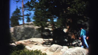 1969: a man walking up the path along a beautiful mountain ridge YOSEMITE,