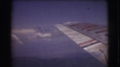 1951: view from airplane in flight changes to garden scene CANADA