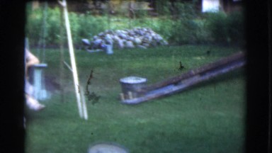1951: family is seen outdoor on swing CANADA