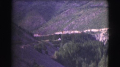 1951: beautiful canyon full of trees plant life and river in unspoiled nature