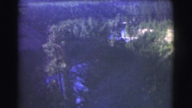1951: a beautiful river and rugged mountain ridgeline with a bright blue sky