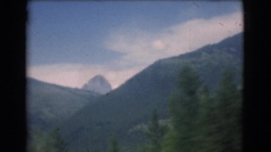 1951: mountain view with evergreens and motion CANADA