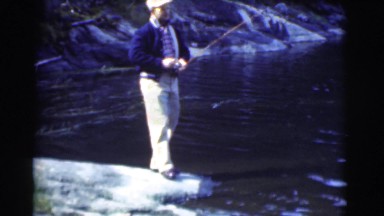 1951: finding the best fishing spot on the rocks at the edge of the lake CANADA