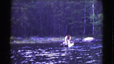 1951: two men starting a boat engine CANADA