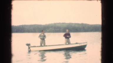 1951: two gentlemen in their boat out on the lake for a day of fishing CANADA