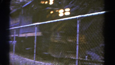 1967: passenger train closeup whizzing by the tracks at high speed COLORADO