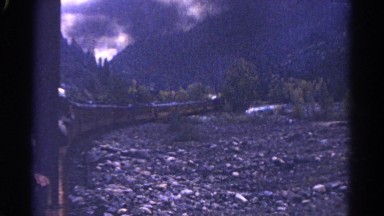 1967: the train makes it's was around the base of cold blue mountain. COLORADO