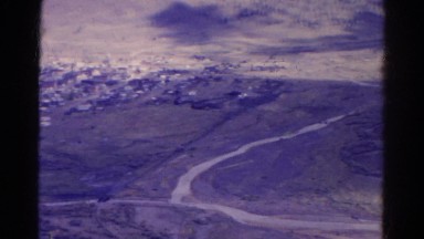 1967: curving and splitting road divides mountains and populated area COLORADO
