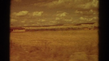 1967: people drive past the countryside and public building COLORADO