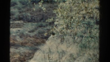 1967: art video double exposure of western dry landscape train travels. COLORADO