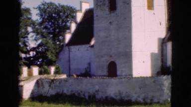 1948: panoramic view of an old church located next to cemetery