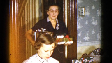 1951: grandma dropping off wrapped christmas gifts DANVILLE, ILLINOIS