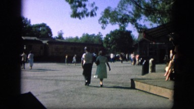 1963: married couple walking to meet train station CALIFORNIA
