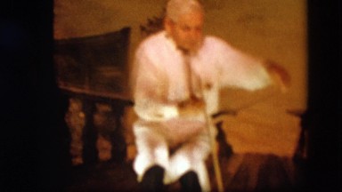 1963: an old man is playing on strange instrument CALIFORNIA