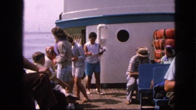 1963: people on boat in scenic waters preparing to eat CALIFORNIA