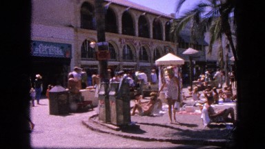 1963: busy tropical vacation spot with people sunbathing CALIFORNIA