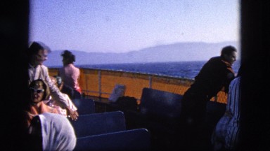1963: people on boat ride that seems to be rocking quite lot in body of water