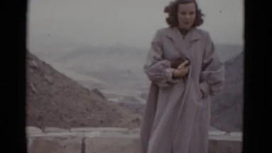 1952: lady poses for picture in front of huge valley ARIZONA