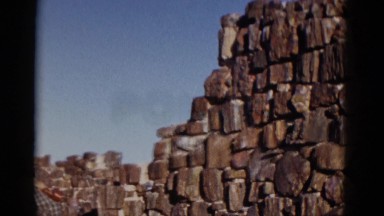 1952: woman sitting on rocks, tourist footage