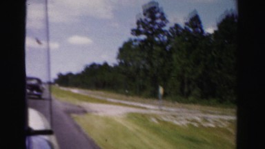 1955: freedom of driving the open road through great northern forests MIAMI