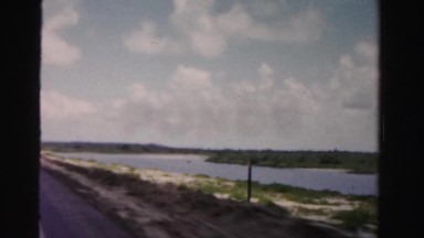 1955: large river or lake as seen from moving vehicle MIAMI, FLORIDA