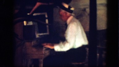 1963: An Old Man in a White Shirt Typing Fast in a California Office