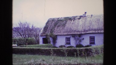 1969: an beautiful, quaint, old english cottage with a thatch roof ENGLAND