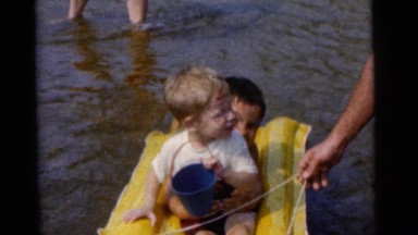 1963: Brothers Floating on Plastic Floater Pulled by Dad at Camden Beach